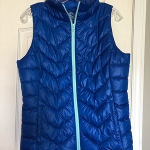 Blue puffer vest, size medium, perfect condition never worn